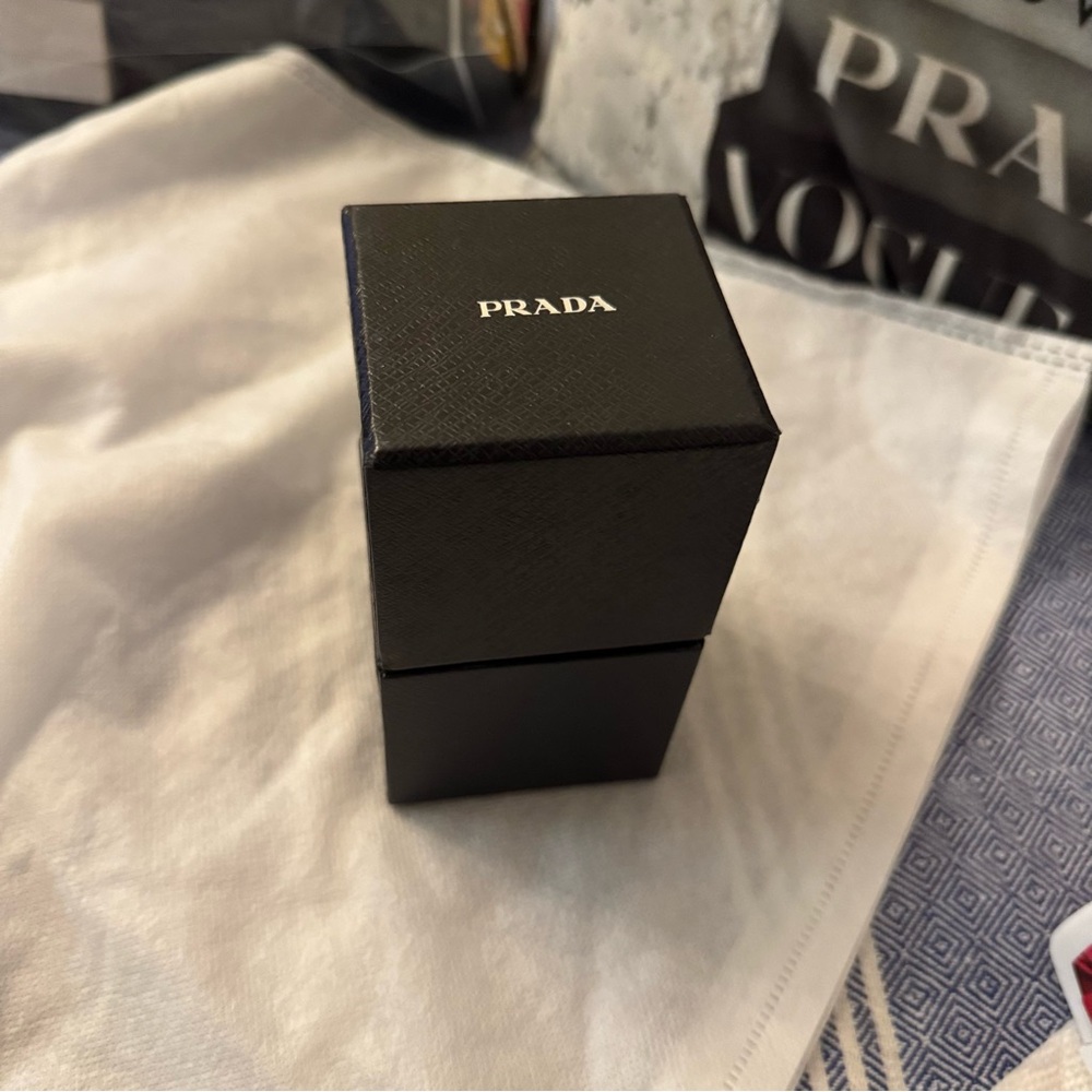 This is the cutest , (seriously), adorable PRADA teddy charm  .